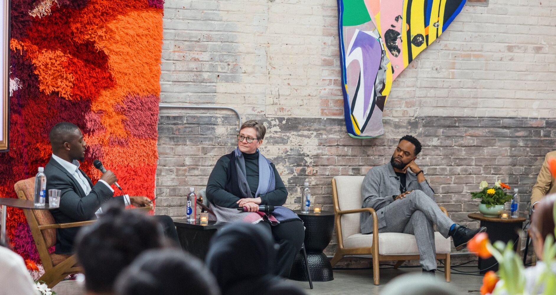 James Frater speaking on a panel at a community event